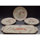 A Poole service, comprising rounded rectangular serving dish and six circular plates,