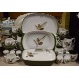 A Langley Conifer pattern dinner service, for six, comprising dinner plates, bowls, seven cups,