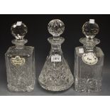 A matched pair of lead crystal square decanters and stoppers;