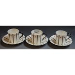 A set of three Royal Worcester coffee cans and saucers,