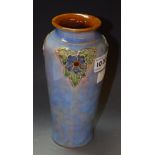 A Royal Douton stoneware tapering cylindrical vase, by Lily Partington,