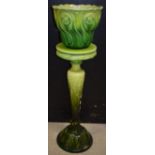 A Bretby green glazed majolica jardinere and stand,