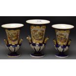 A trio of Coalport style urns, twin handled, cobalt blue ground, painted panels, rural scenes,