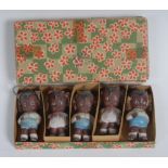 A set of five early to mid-20th century Japanese bisque porcelain miniature dolls or cake