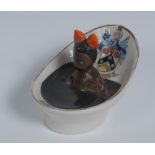 A Carlton China Crested Ware model, of a black girl wearing a red ribbon in a tin bath,