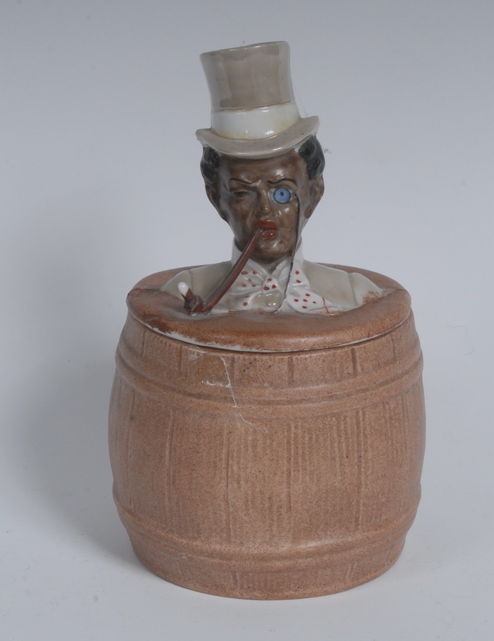 An early 20th century Continental bisque porcelain novelty tobacco jar, as a black gentleman,