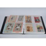 Postcards - Black Memorabilia - Thirty-two coloured postcards, various manufactures,