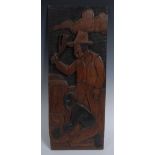 Slavery - a folk art panel, carved in relief with an overseer taking a whip to a bound African man,