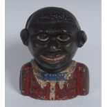 An early 20th century cast iron The Young Ni**er bank, with blue bow tie and red jacket, 12cm high,