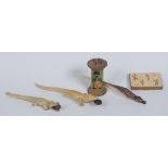 A mid 20th century plastic novelty pencil and holder, as a black boy consumed by an alligator,