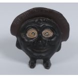 A Chamberlin & Hill cast iron "Save and Smile Money Box", as a large head with wide eyes,