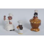 A novelty pie funnel, modelled as black chef, emerging from the crust of pie, 11cm high,