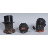 An Austrian terracotta model, the head of a black man, smiling smoking his pipe, red collar,