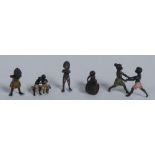 A cold painted bronze group, of a young black girl and boy dancing,