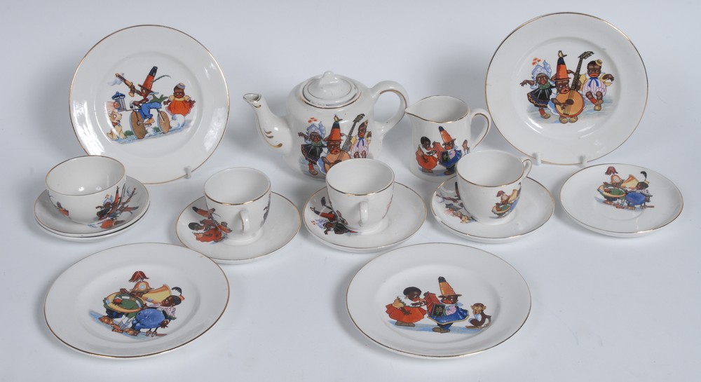 A child's nursery tea service, each printed with comical black figures, comprising teapot and cover,