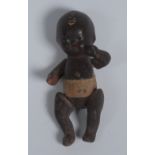 Black Americana - a miniature black baby doll, articulated limbs,