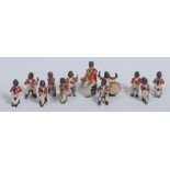 A set of twelve early 20th century cold painted novelty figures, cast as a black jazz band,