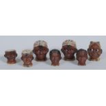 A pair of mid 20th century novelty condiments, moulded with as black boy heads,