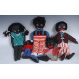 A knitted woollen Golly-type doll, dressed in striped dungarees,