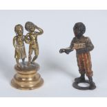 An Austrian cold painted bronze, of a young black chorister, he stands, smartly dressed,