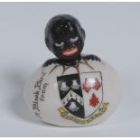 An Arcadian China Crested Ware egg, with hatching black boy, inscribed A Balck Bird From,
