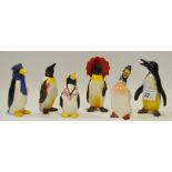 A Wade Penguin salt and pepper pot; a Beswick Penguin with a red umbrella,