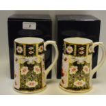 A pair of Royal Crown Derby 2451 pattern spreading cylindrical mugs, Millennium 2000, 13.