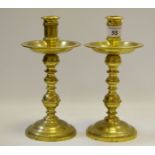 A pair of Dutch brass heemskerk candlesticks