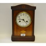 An Edwardian mantel clock, enamel dial, twin winding holes, central diamond shaped satinwood patera,