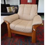 An Ekornes Stressless Buckingham armchair, cafe-au-lait leather upholstery.