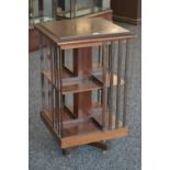 An Edwardian mahogany revolving bookcase. 88cm high x 51.5cm square.