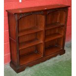 An Old Charm oak bookcase. 107cm high x 122cm wide x 28cm deep.