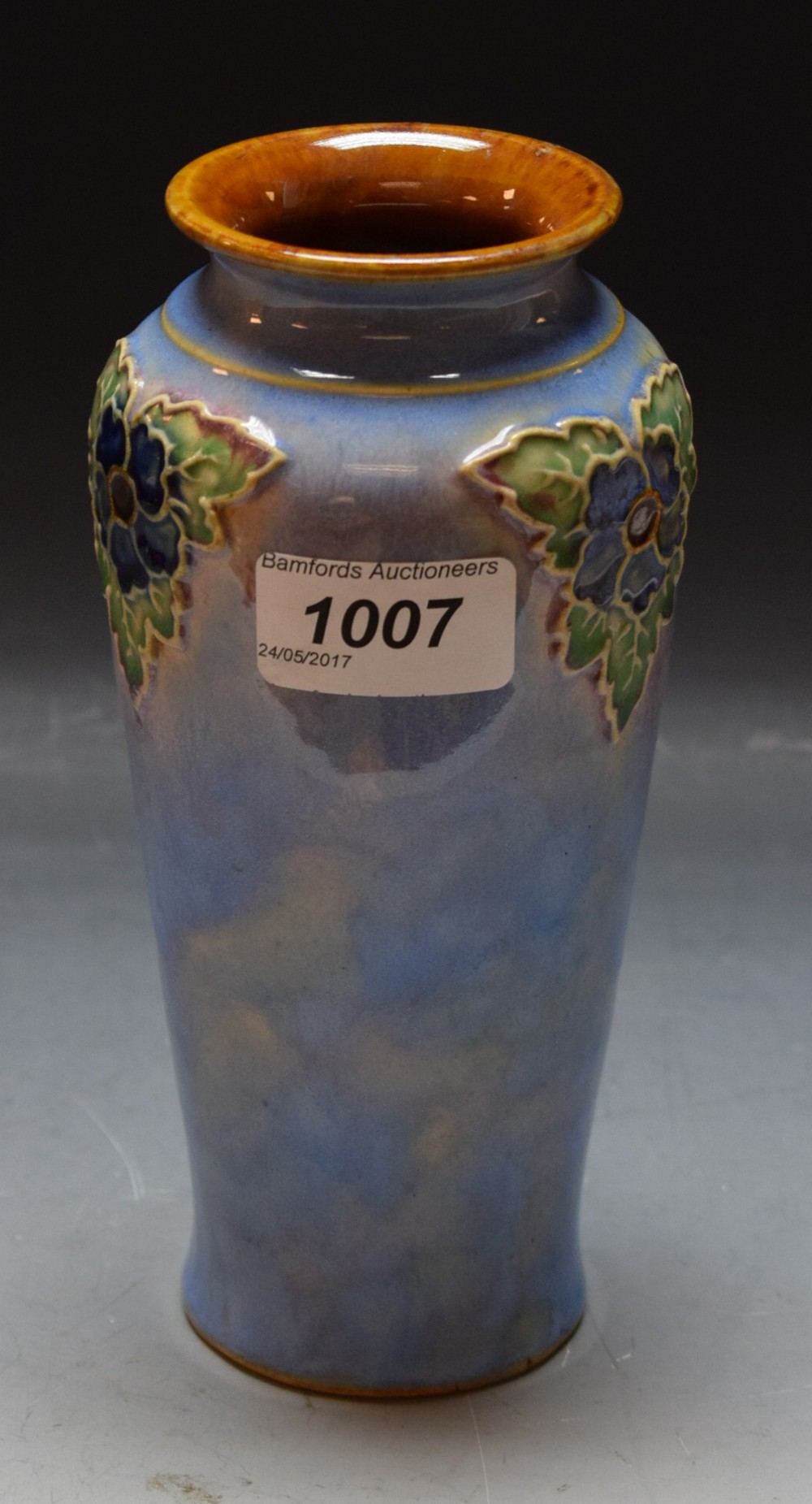 A Royal Douton stoneware tapering cylindrical vase, by Lily Partington,