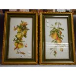 A pair of white opaque glass panels, painted with autumn fruits,