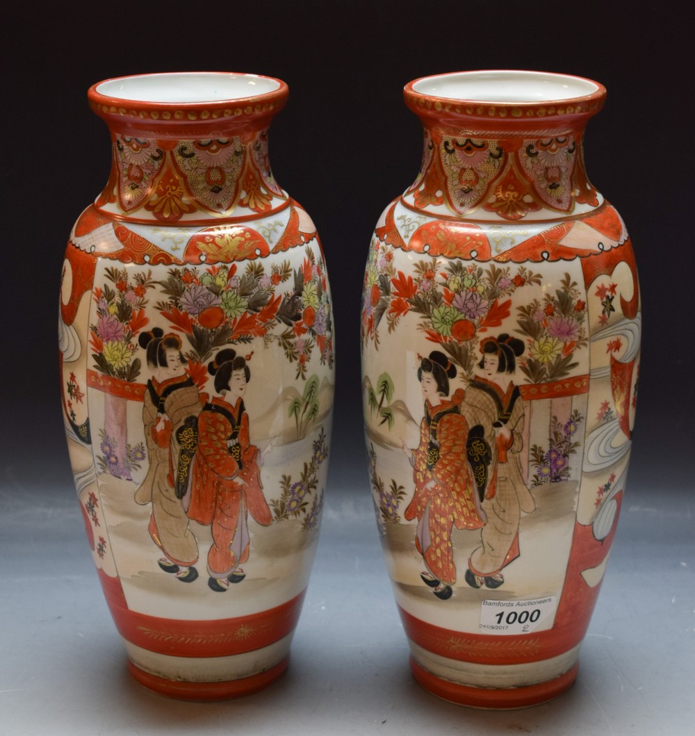 A pair of Japanese Kutani baluster vases decorated with Geisha and peacocks