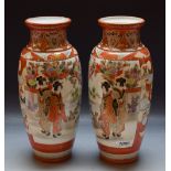 A pair of Japanese Kutani baluster vases decorated with Geisha and peacocks
