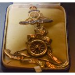 A Royal Artillery enamel brooch and cap badge,