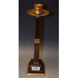 A French Art Deco rosewood table candlestick, in the style of Ruhlmann, brass sconce,