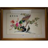 A Chinese silk embroidery picture, Peacock and Hen in an Oriental garden, bears script,