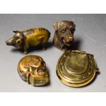 A novelty brass vesta cast as a hound's head, 4cm; another as a skull,