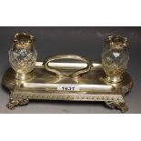 A silver coloured metal Victorian style desk stand,