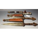 Tribal Art - an African dagger, geometric leatherwork scabbard, probably Nigerian; another,