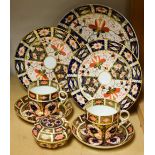 Royal Crown Derby - a pair of 1128 Imari coffee cans and saucers;