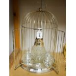 A silver plated birdcage decanter set