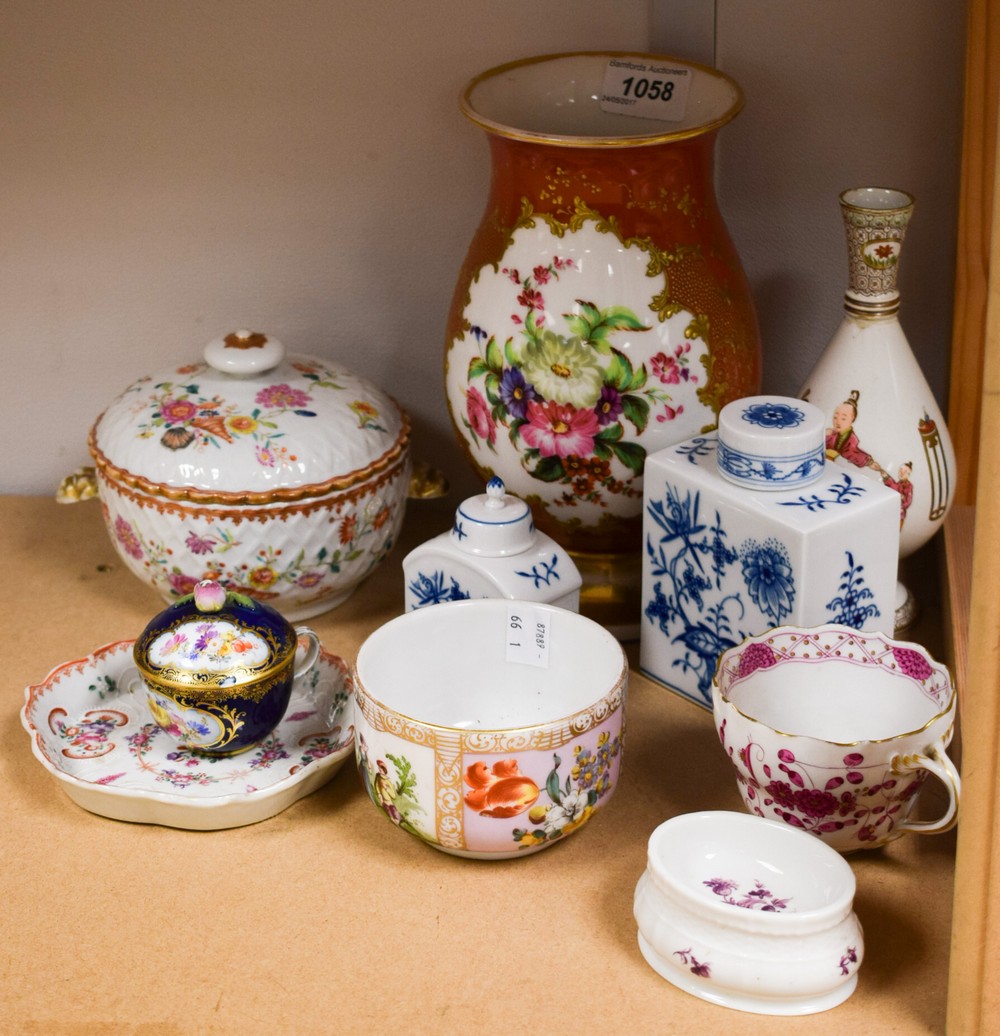 A Meissen cabinet cup and cover, painted with a floral reserve, blue ground with gilding,