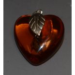 A sterling silver mounted faux amber love heart shaped pendant