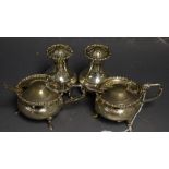 A silver four piece cruet set, with two associated silver mustard spoons,