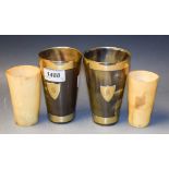 A pair of 19th century horn beakers, brass mounted,