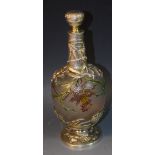 A French 19th Century style glass decanter with silver coloured metal overlay,