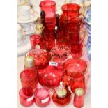 A quantity of cranberry glass jugs, vases, drinking glasses, sugar sifters,